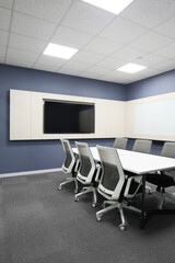 Modern meeting room with wide screen TV