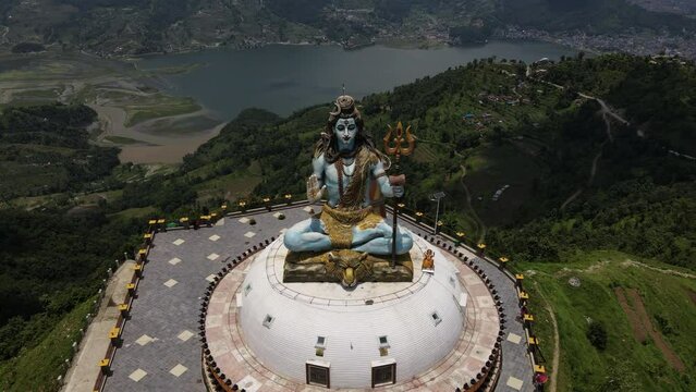 Aerial view of the giant statue of Lord Shiva in Nepal. Drone flight with a view of the Mahadev Monument in Pokhara. Cinematic 4k footage.