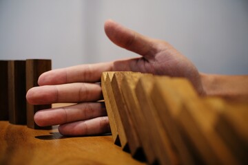 Planning risk and strategy in businessman gambling placing wooden block.Business concept for growth...