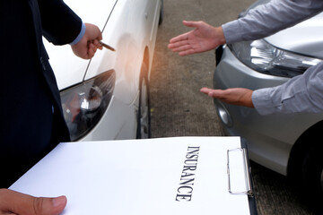 Loss Adjuster Insurance Agent Inspecting Damaged Car.