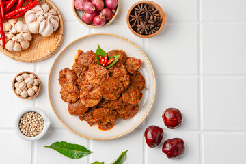 Rendang Jengkol, dogfruit simmered in spices and coconut milk. Indonesian traditional comfort food, with a spicy savory taste typical of rendang and a legit jengkol texture.