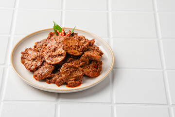 Rendang Jengkol, dogfruit simmered in spices and coconut milk. Indonesian traditional comfort food, with a spicy savory taste typical of rendang and a legit jengkol texture.