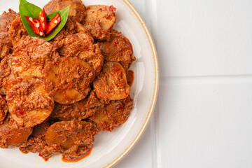 Rendang Jengkol, dogfruit simmered in spices and coconut milk. Indonesian traditional comfort food, with a spicy savory taste typical of rendang and a legit jengkol texture.