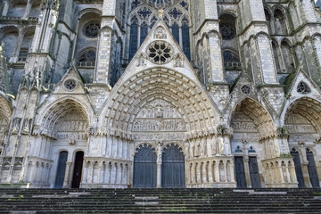 Bourges, medieval city in France, the Saint-Etienne cathedral, main entry with saints statues
