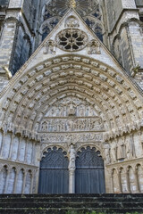 Bourges, medieval city in France, the Saint-Etienne cathedral, main entry with saints statues
