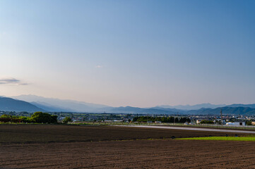 Fototapeta na wymiar 初夏の夕方　山形村から安曇野方面の風景