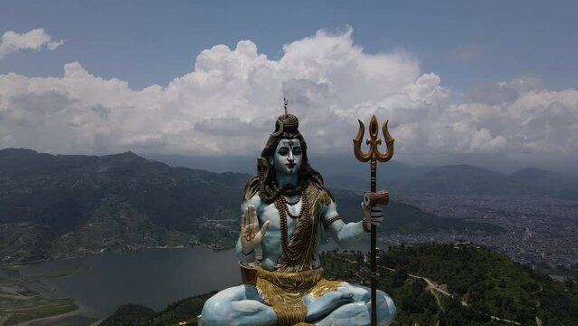 Aerial view of the big statue of Lord Shiva in Nepal. Drone flight with a view of the Mahadev Monument in Pokhara. Cinematic 4k footage.