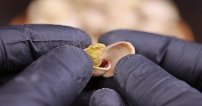 salted pistachio nuts on the table, a large number of salty and crispy pistachios close-up