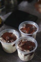 Closeup of Iced Caramel Macchiato at the coffee shop, Caramel Macchiato is a classic macchiato beverage. It consists of vanilla syrup, espresso, steamed milk, foam, and caramel drizzle