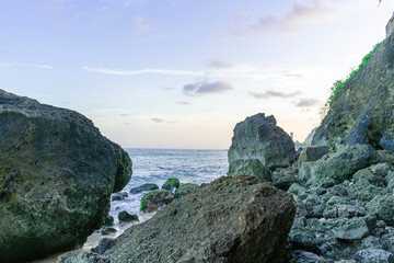 Fototapeta na wymiar View of beautiful coral rocks by the ocean under a beautiful blue sky horizon