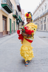 Cuban woman called canasteras with habano flowers and typical costume in La Havana, Afro caribbean...