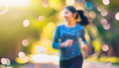Fototapeta na wymiar Defocused bokeh effect positive concept background of unrecognizable people enjoying healthy lifstyle exercising fitness outside