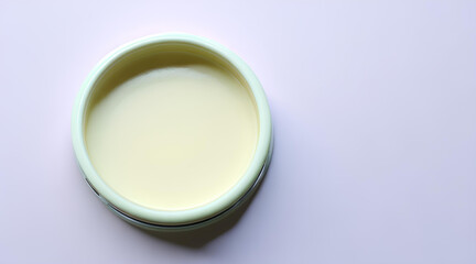 A small jar with cosmetic cream and a place for text, a template for a banner, a means for health and hygiene