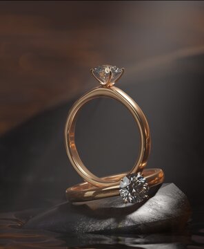 3D rendering design. Two gold diamond rings on the rocks in the lake. with a macro image highlighting the gold ring from the precious jewelry concept.