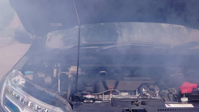 Mechanical Failure: Broken Car with Smoke Coming from Radiator  - Automotive Repair Needed