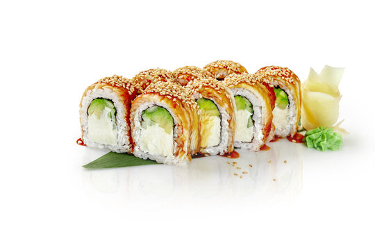 Philadelphia rolls with eel, unagi sauce and sesame on bamboo leaf