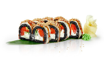 Black rice sushi rolls with salmon, eel, unagi sauce and sesame on bamboo leaf