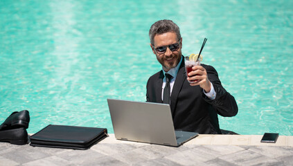 business man working remote with laptop, advertisement. photo of business man working remote - Powered by Adobe