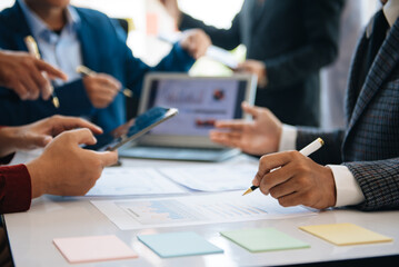 Fototapeta premium Business team collaboration discussing working analyzing with financial data and marketing growth report graph in team, presentation and digital tablet, laptop.