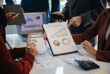 Business people meeting at office writing notes about sticky notes Laptop,tablet  Planning and Brainstorming Strategies of Colleagues