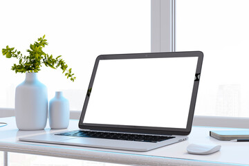 Close up of clean designer office desktop with white mock up computer screen, decorative vase with plant, other objects and window with city view in the background. 3D Rendering.