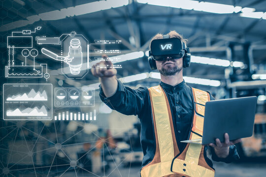 Engineer male using VR virtual reality technology in modern warehouse factory new innovation engineering