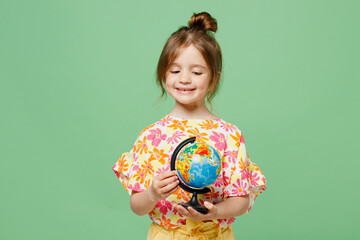 Little cute child kid girl 6-7 year old wear casual clothes have fun hold in hands globe Earth map isolated on plain pastel green background studio portrait Mother's Day love family lifestyle concept