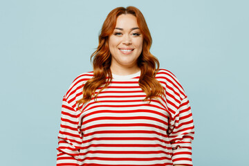 Young smiling happy fun optimistic chubby overweight woman she wearing striped red shirt casual...