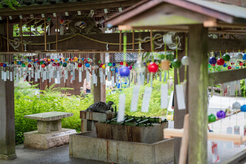 Fototapeta na wymiar Kyoto, Japan - June 12 2023 : Japanese wind chimes at Matsunoo Taisha Shrine. Japanese Garden Wind bells.