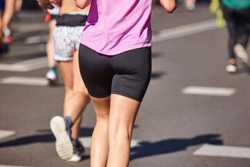 Fototapeta premium Runners on the street. Healthy lifestyle. Jogging exercise. Athletics