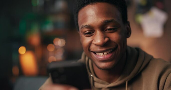 Stundent boy holding a cellphone, engages in joyful language exchange conversations with learners from around the world.