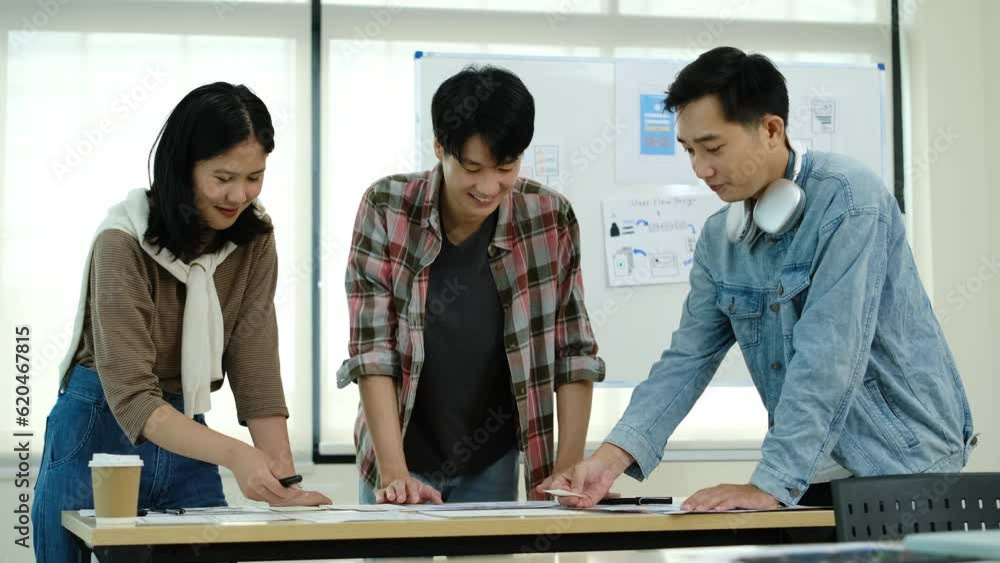 Aufkleber team of web designers are brainstorming about mobile app interface wireframe design together