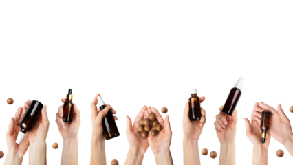 Female caucasian hands hold beauty cosmetisc products and macadamia nuts on white background
