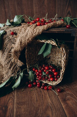 Cherries in a wicker basket on a wooden background. Organic food. Vitamins. Diet. Juicy fruits.