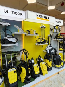 Karcher brand mini-washers and vacuum cleaners for indoor, outdoor use. Branded stand of products manufactured by Karcher in sales area of home appliances store. Technics and electronics shop. Kärcher