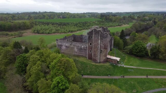 Doune castle: movement in orbit at medium distance to the famous Scottish castle and spotting the outer grove of the area.