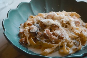 closeup mushroom cream pasta with bacon and cheese