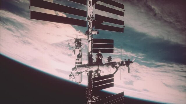 stunning panorama of the sunlit space station seen from a spacecraft revolving around the planet. Elements of this image furnished by NASA