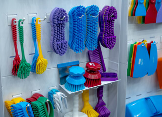 Brushes hang on shelf. Dish wash brush, professional double wing scrub, round scrub for food...