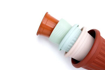 Plastic plant pots, containers on white background.
