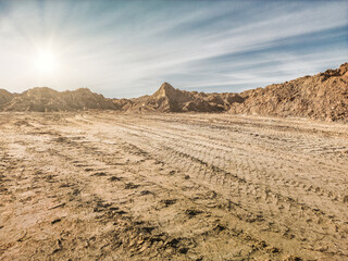 Sand pit. Sand special for construction. Pit full of fine sand and truck tracks.