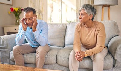 Senior couple, stress and divorce in fight, conflict or argument for disagreement on living room...