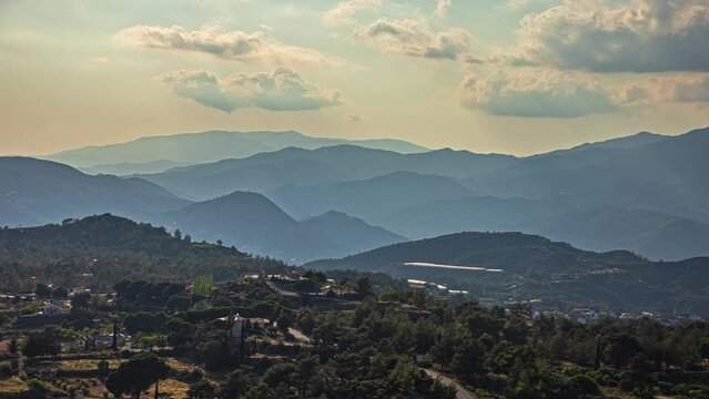 Hazy sunset over the forest mountains at Limassol, Cyprus - time lapse