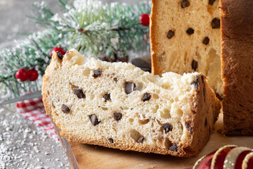 Christmas cake panettone on wooden table. Close up