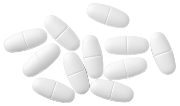 White oval pills isolated on white background, top view.