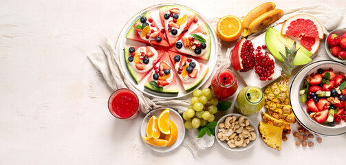 Summer fruits assorted on white background. Fresh raw food concept.