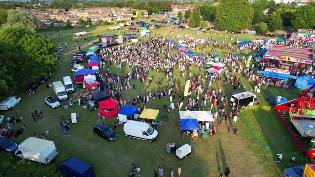 High Angle Footage of Public Funfair Held at Lewsey Public Park of Luton with Free Access for Muslim Community on Islamic Holy Eid Festival Day. Captured with Drone's Camera on June 29th, 2023