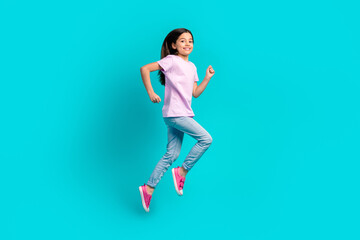 Full body photo of small girl run fast speed have fun wear pink t-shirt jeans hurry after school...