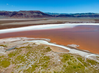 Argentina: Puna - aerial view of the colorful Laguna Carachi Pampa, a surreal and beautiful landscape surrounded by volcanic rocks and dunes of sand