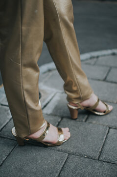 Gold leather pants with gold heels